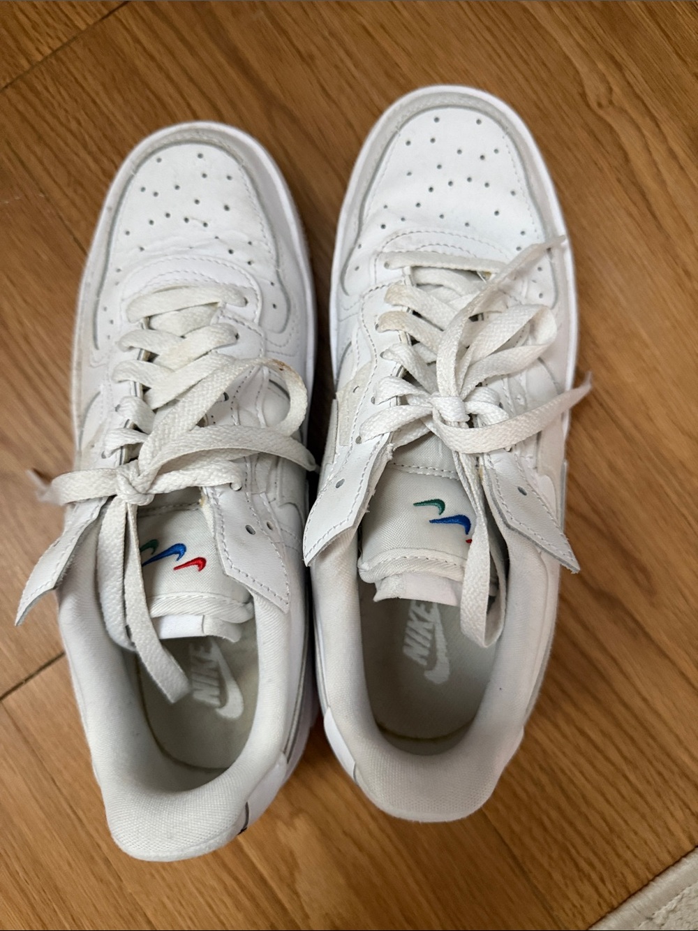 Nike White Leather Low-Top Sneakers with Multicolor Swoosh Details